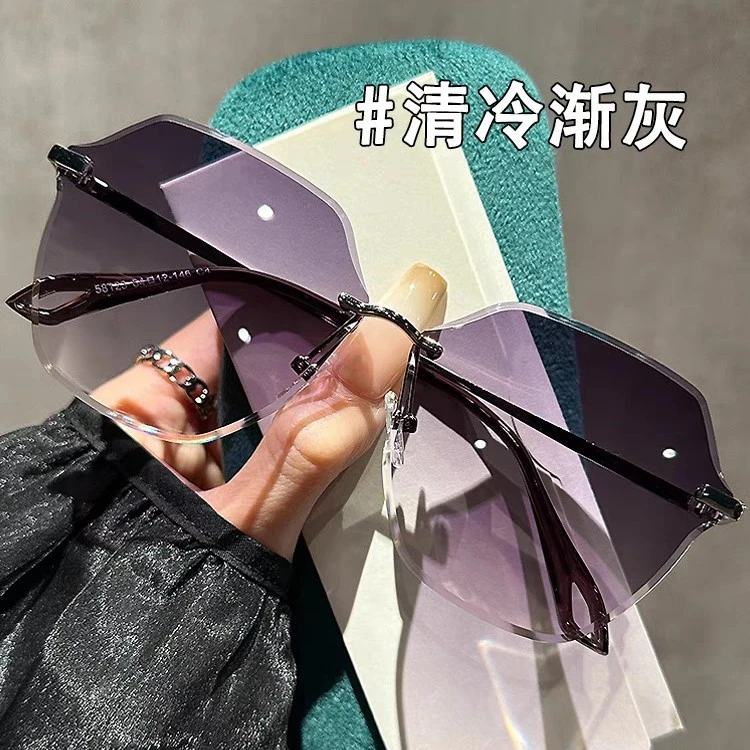 时尚气质女士太阳眼镜网红时尚百搭防紫外线无框渐变灰粉墨镜女潮