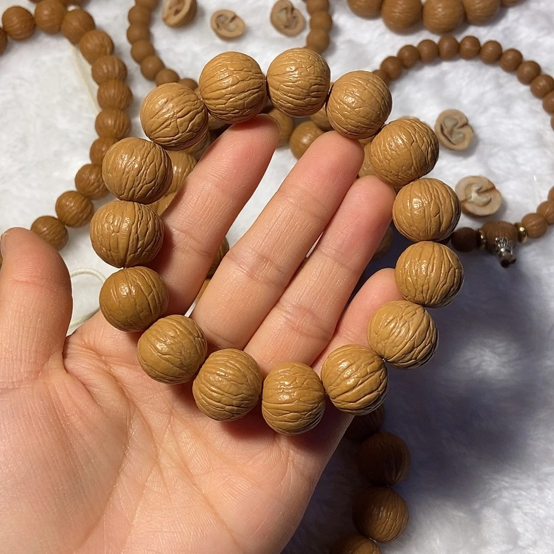 骑***缝木质类猴头核桃聚宝盆手串