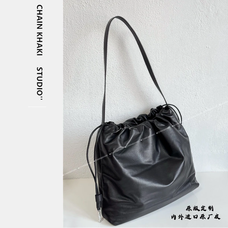 慵懒风软皮抽绳单肩包女包2025新款潮小牛皮休闲云朵包百搭斜挎包