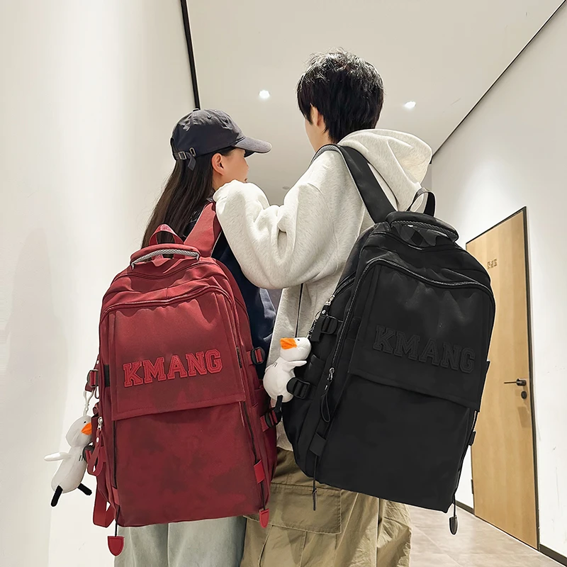 书包女生韩版高中大学生酒红色背包初中生小学生大容量减负双肩包