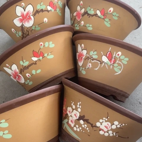 紫砂花盆100-6。          25-13