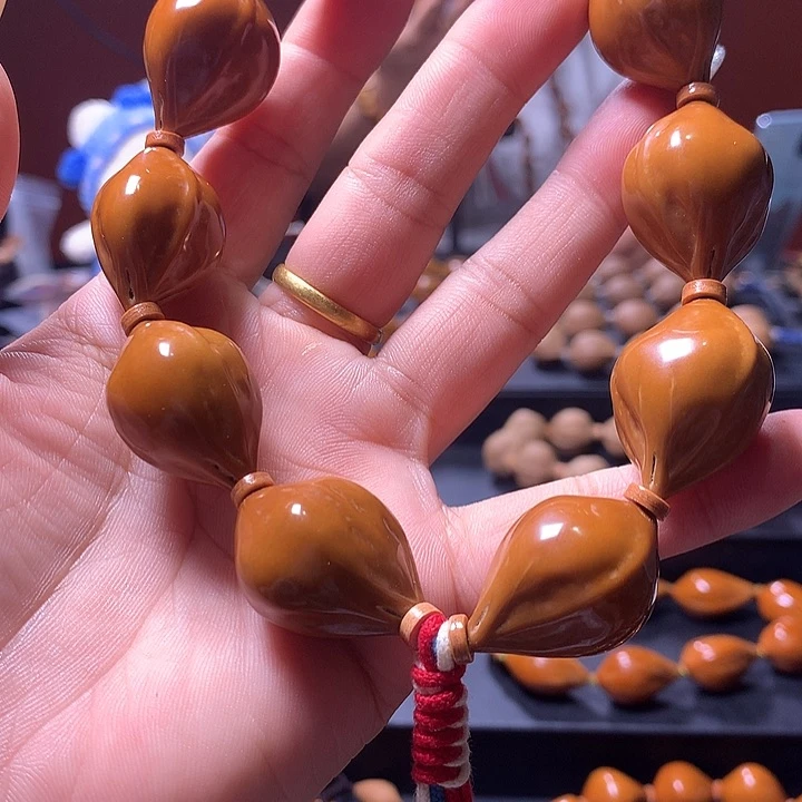 呼***告橄榄核手串/手链三花手串