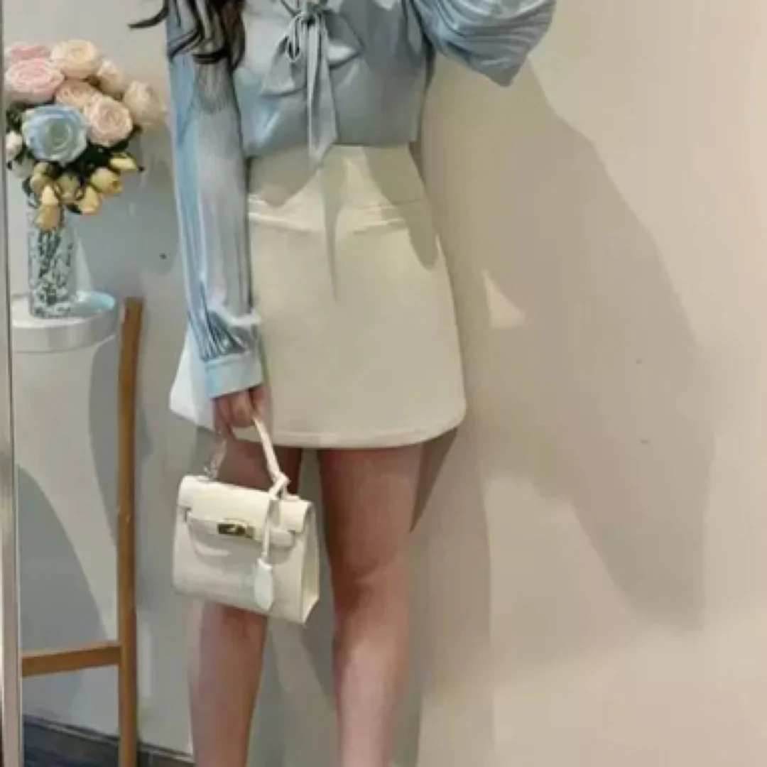 2025新款杏色不规则气质小众半身裙女高腰包臀一步裙