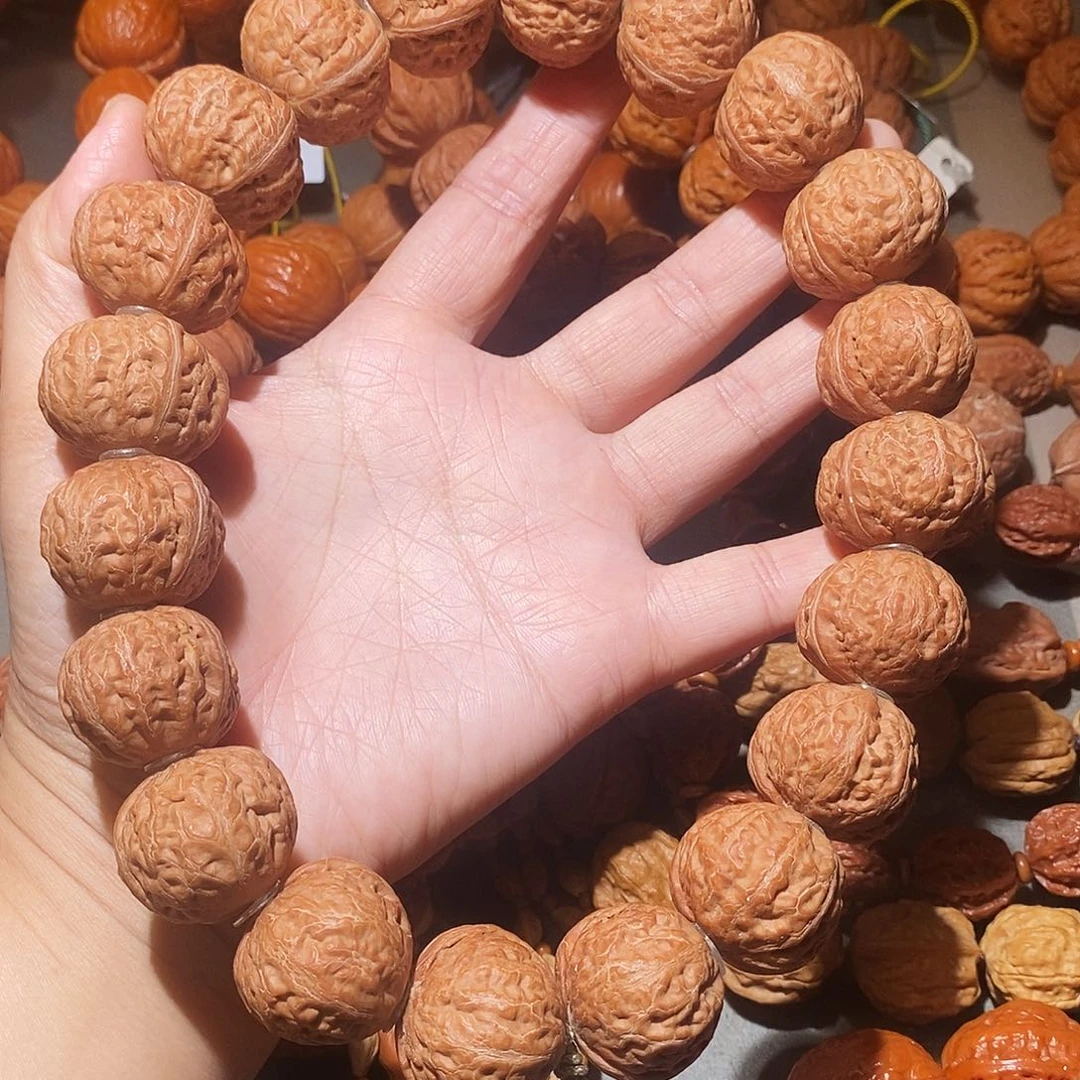 阖***乐文玩核桃吊坠24尺元宝手持