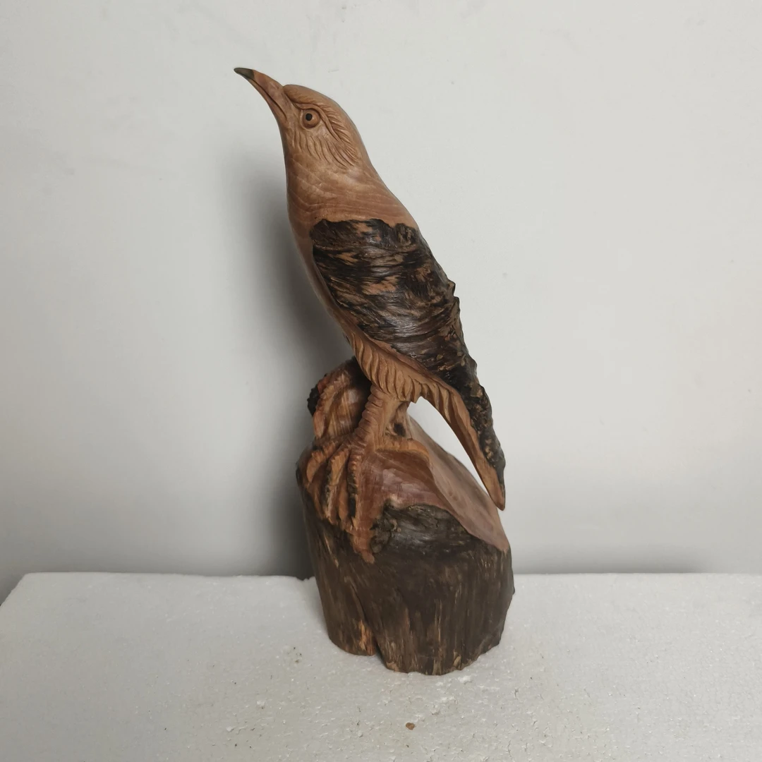 非金属木质吊坠 报喜鸟，琥珀木，立体镂空雕刻，长13宽9高25公分。