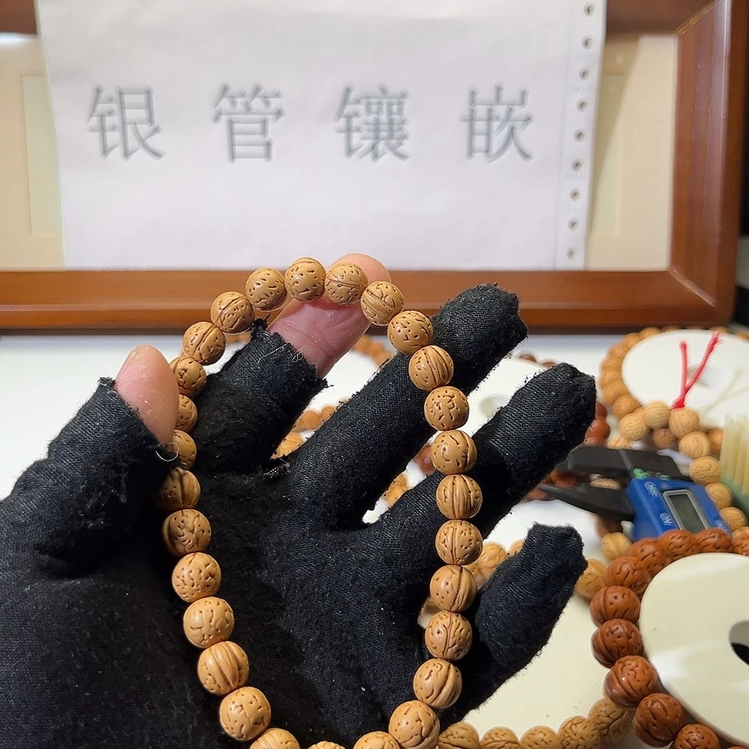 阿***刘手串桃核野生光头强