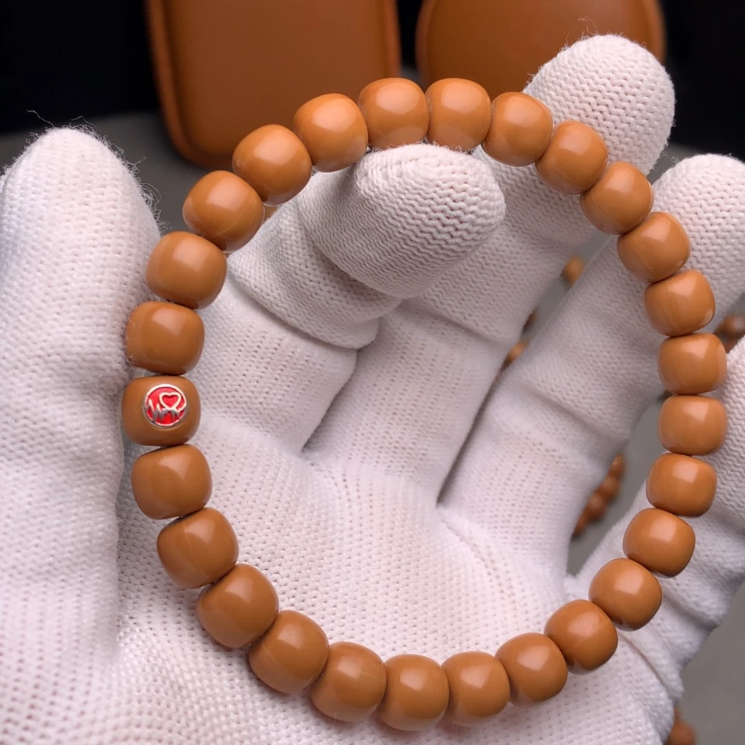 猴头核桃手串老型8.7尺寸镶嵌一个心动银标