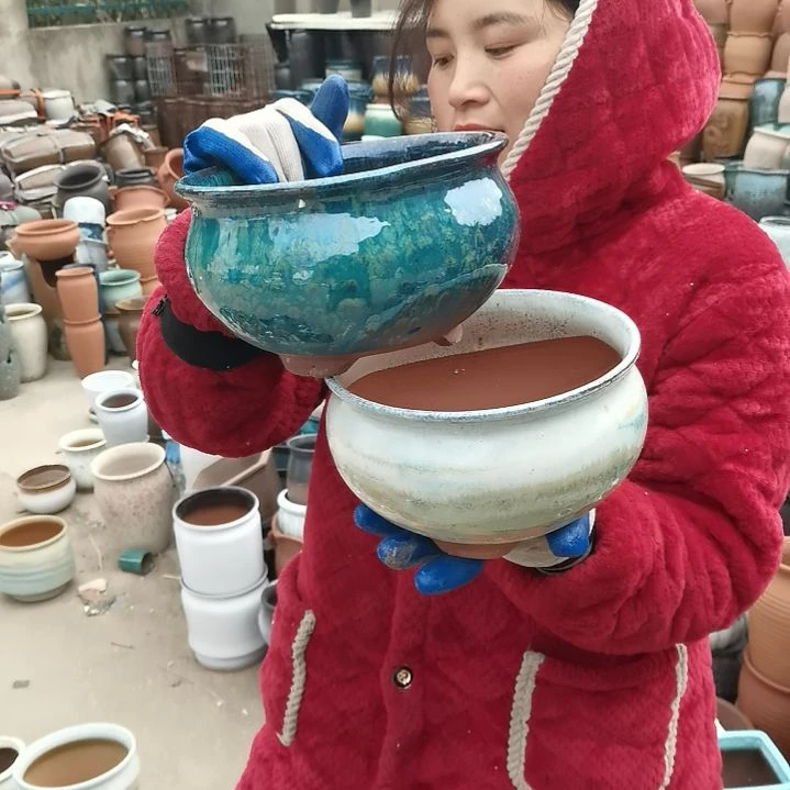 红陶口20高12瑕疵两个”