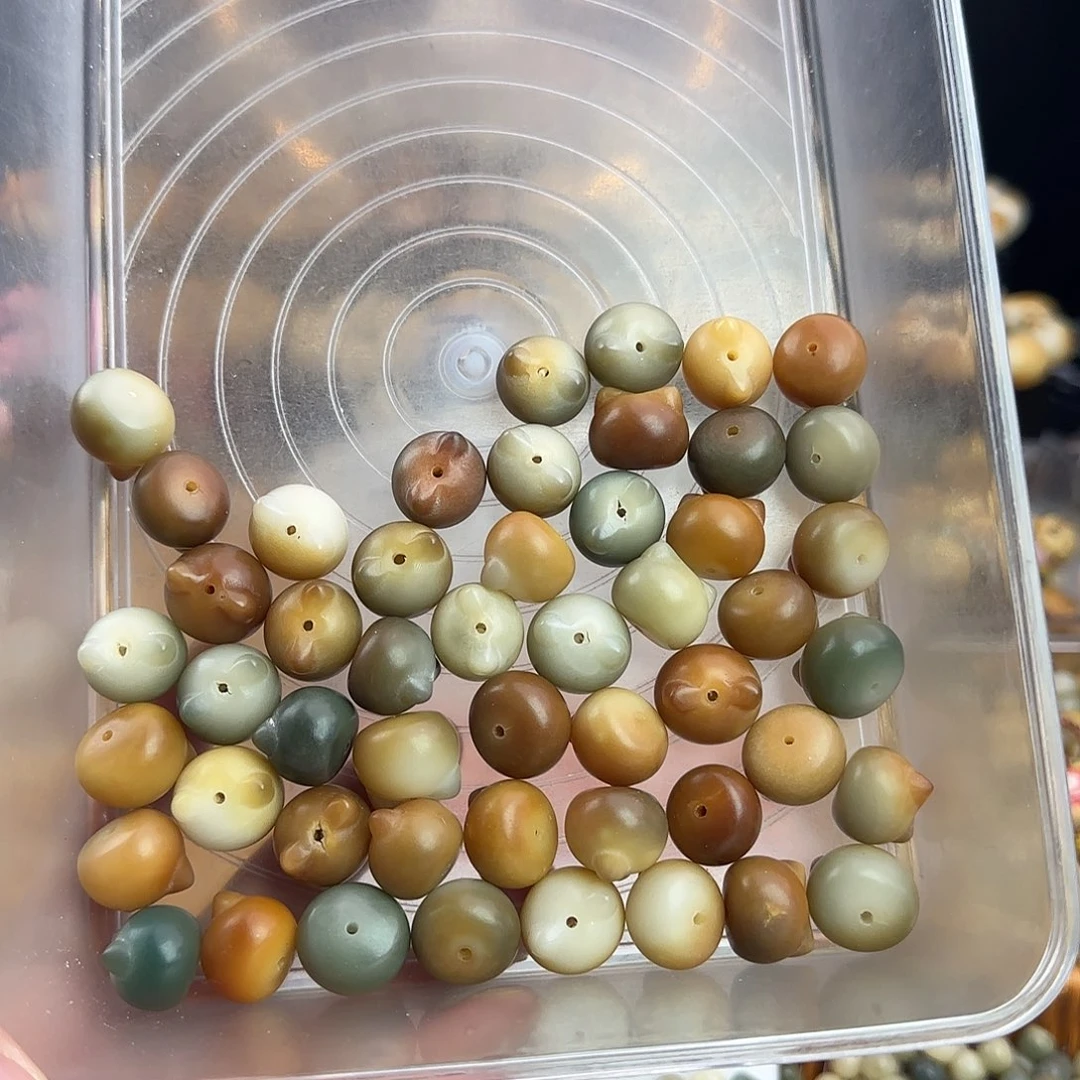 菩提根/象牙果吊坠是***～瑕疵卡17-18猫头50颗