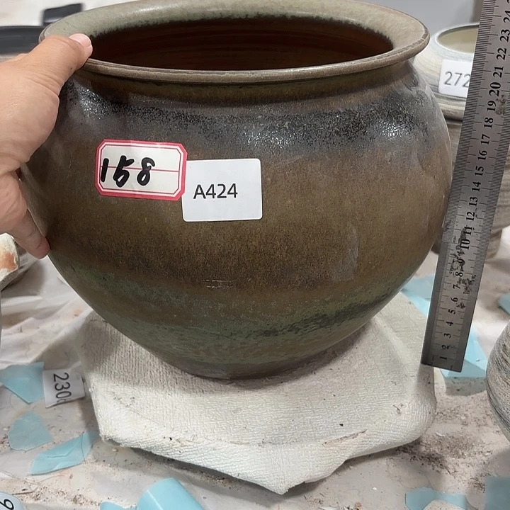 摆件高23，口19，有孔424