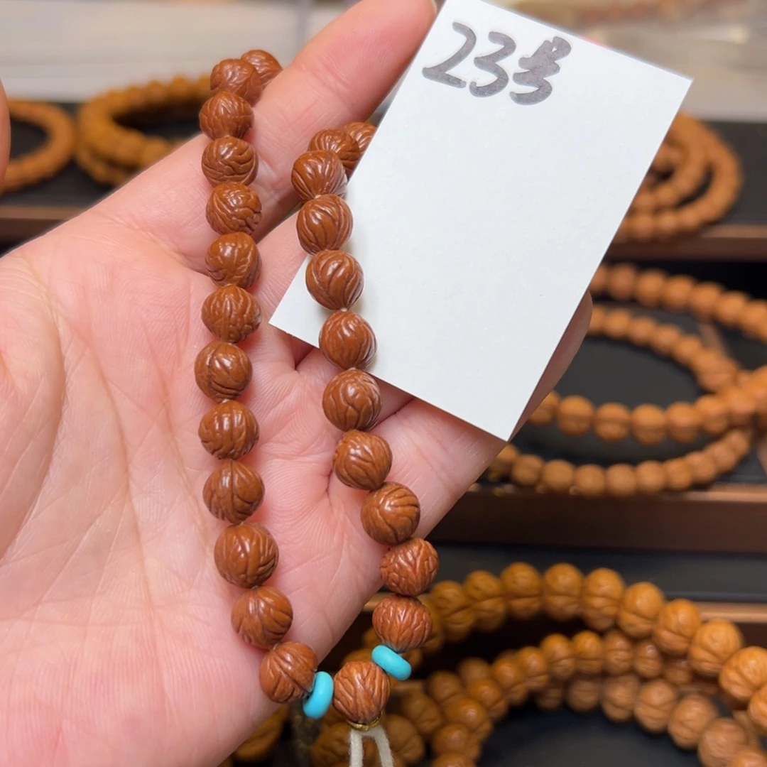 祈***泪文玩核桃把件秦岭龙纹桃核9小奶豆手持