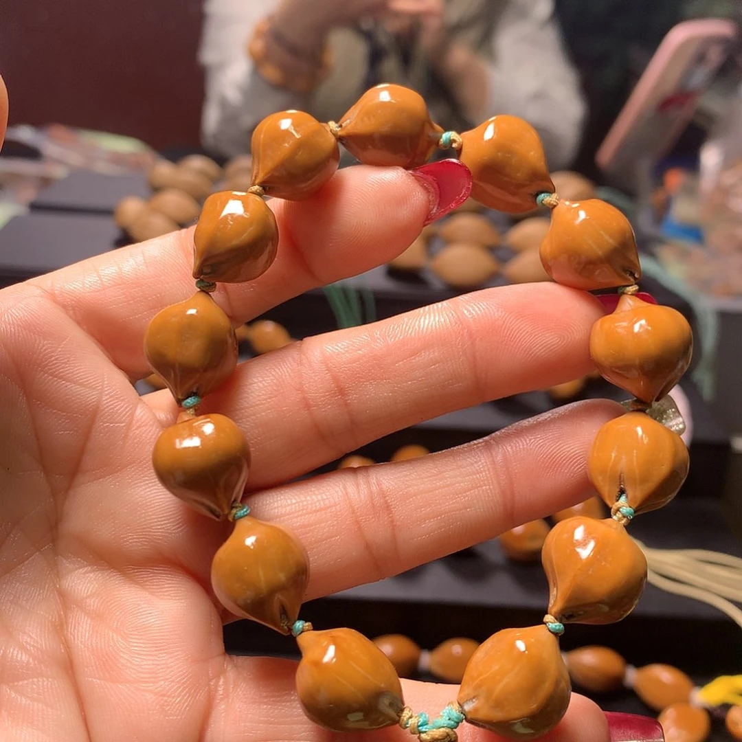 橄榄核手串/手链春****你三花手串