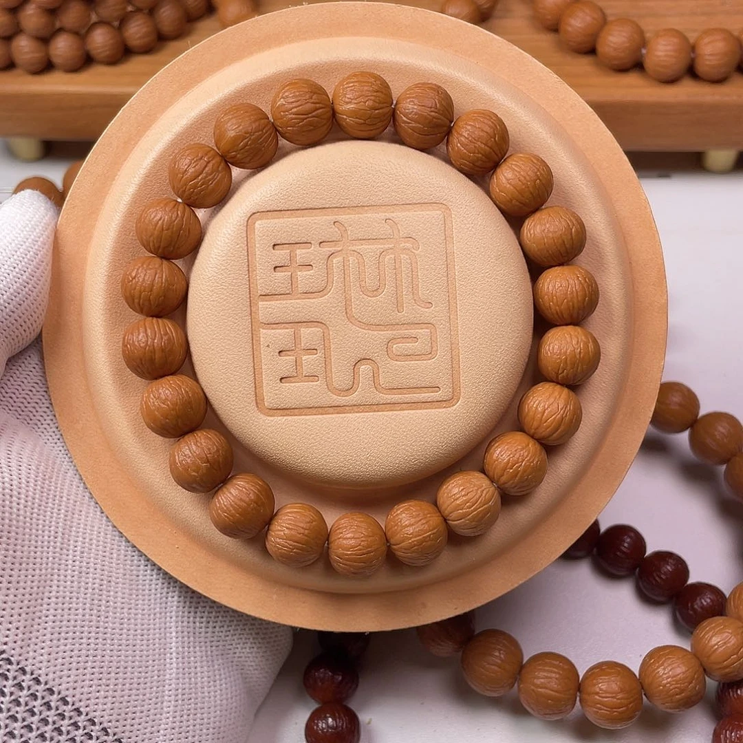 s***1吊坠猴头核桃凤羽