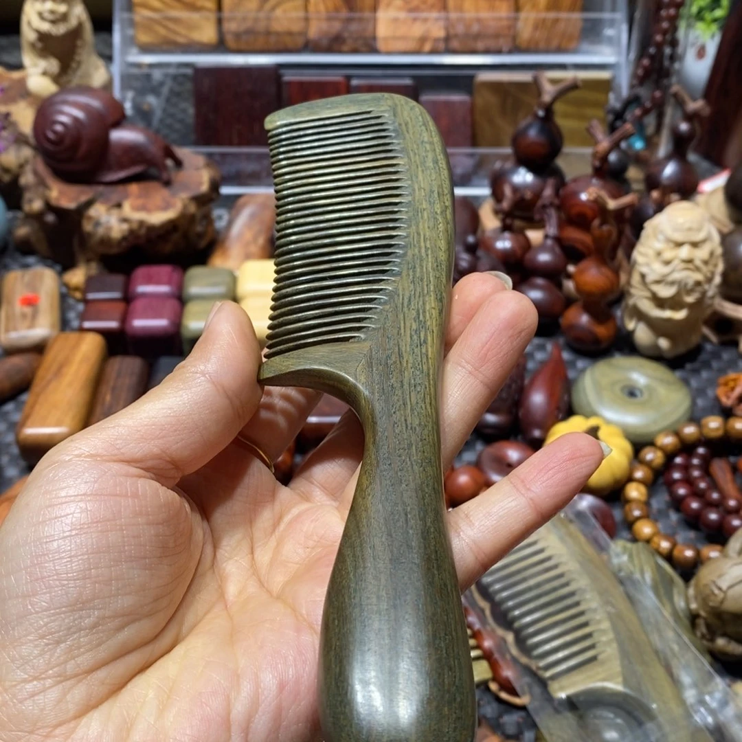 木燃***宙绿檀木梳子一把