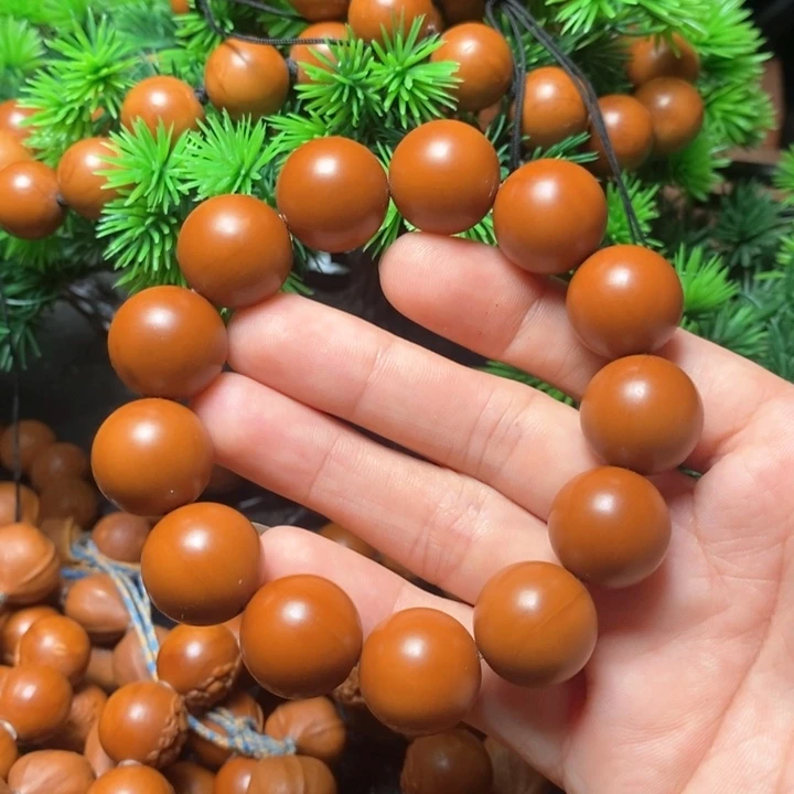 橄榄核手串陆*1.7红料光珠