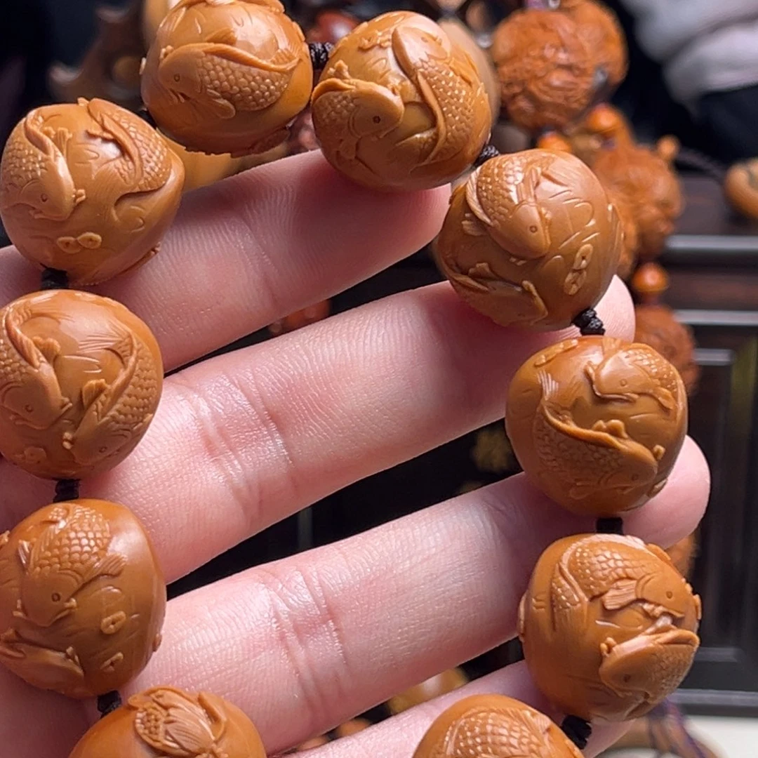 橄榄核吊坠じ****浅双鱼戏莲