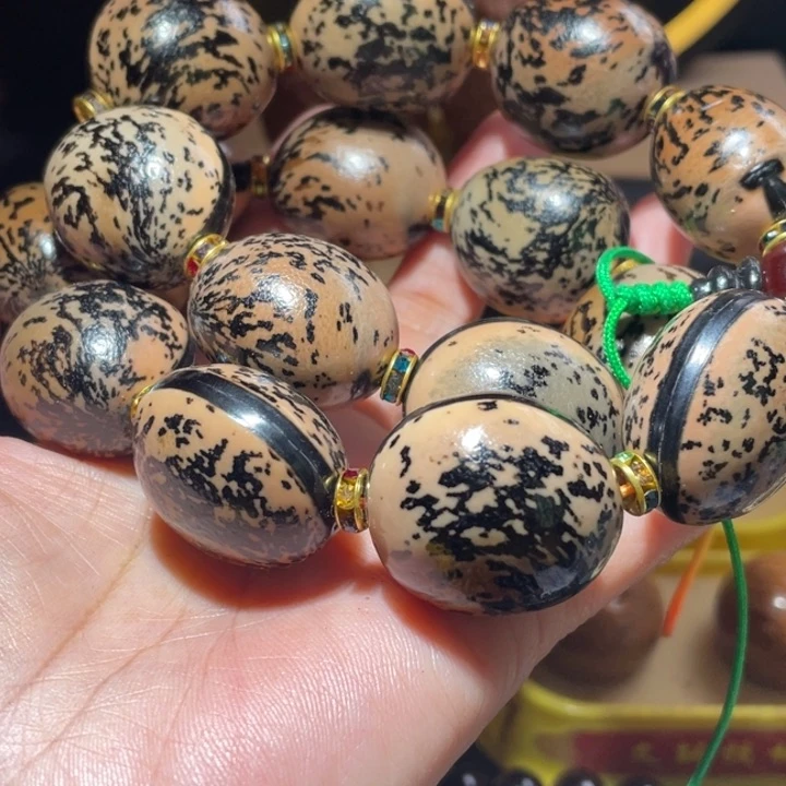 桃核把件D****。木鱼果手持