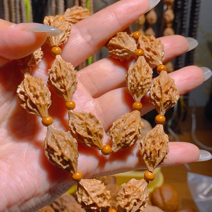 野生麒麟眼橄榄核手持18颗