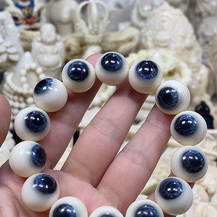 紫檀木类端景台宇**沾猛犸牙蓝眼睛手串