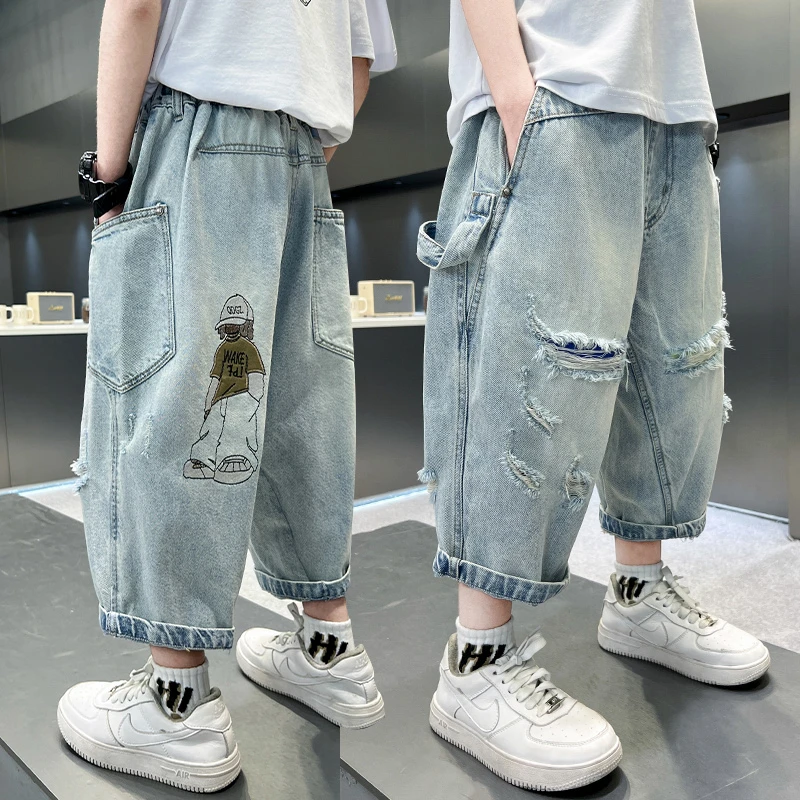 2025新款男童潮趣卡通印花破洞牛仔裤春秋季户外运动时尚长裤