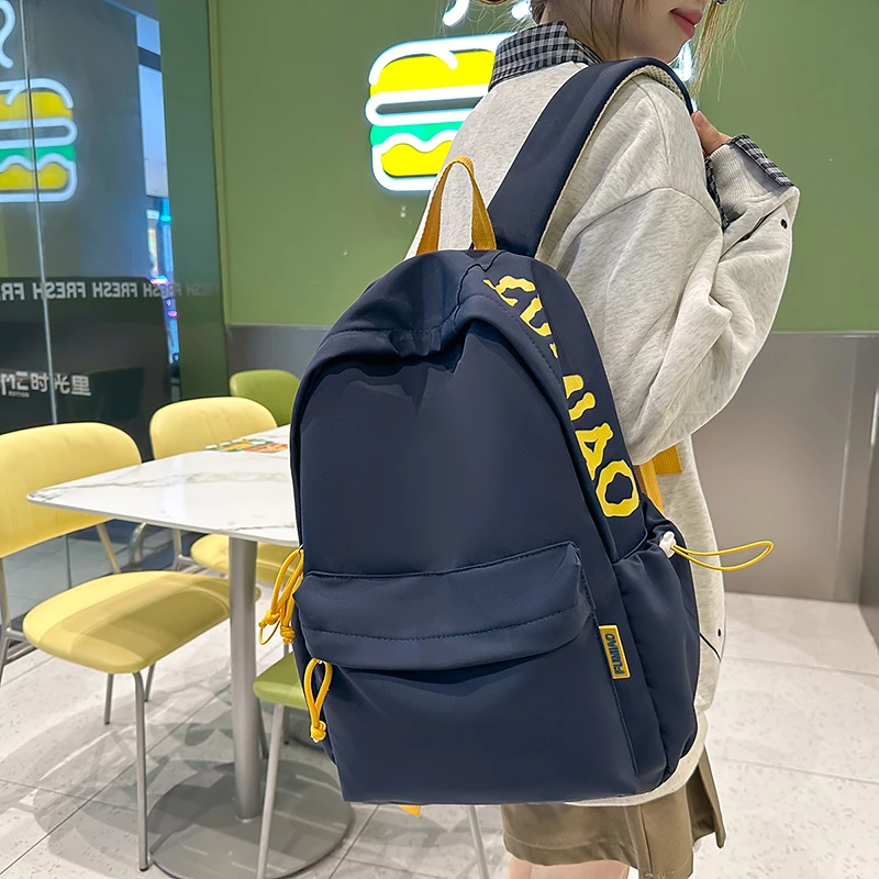 新款日系书包男款大学生书包双肩包初高中生女生韩版大容量背包
