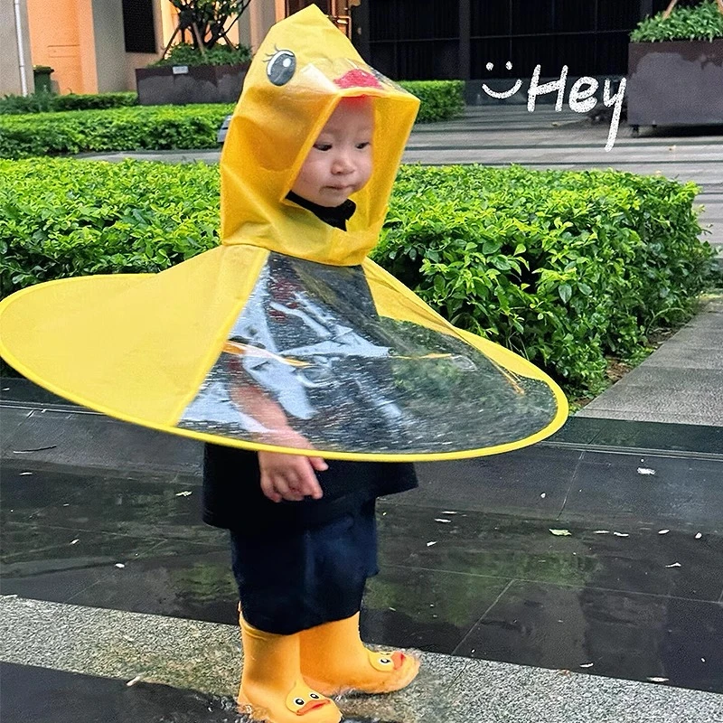 看！飞碟小黄鸭雨衣儿童斗篷式雨伞帽卡通幼儿园宝宝雨伞连体雨服