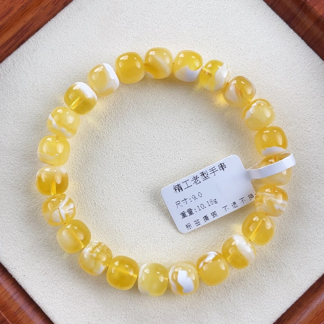 琥珀未镶嵌裸石9mm金瓷白溶洞妖花
