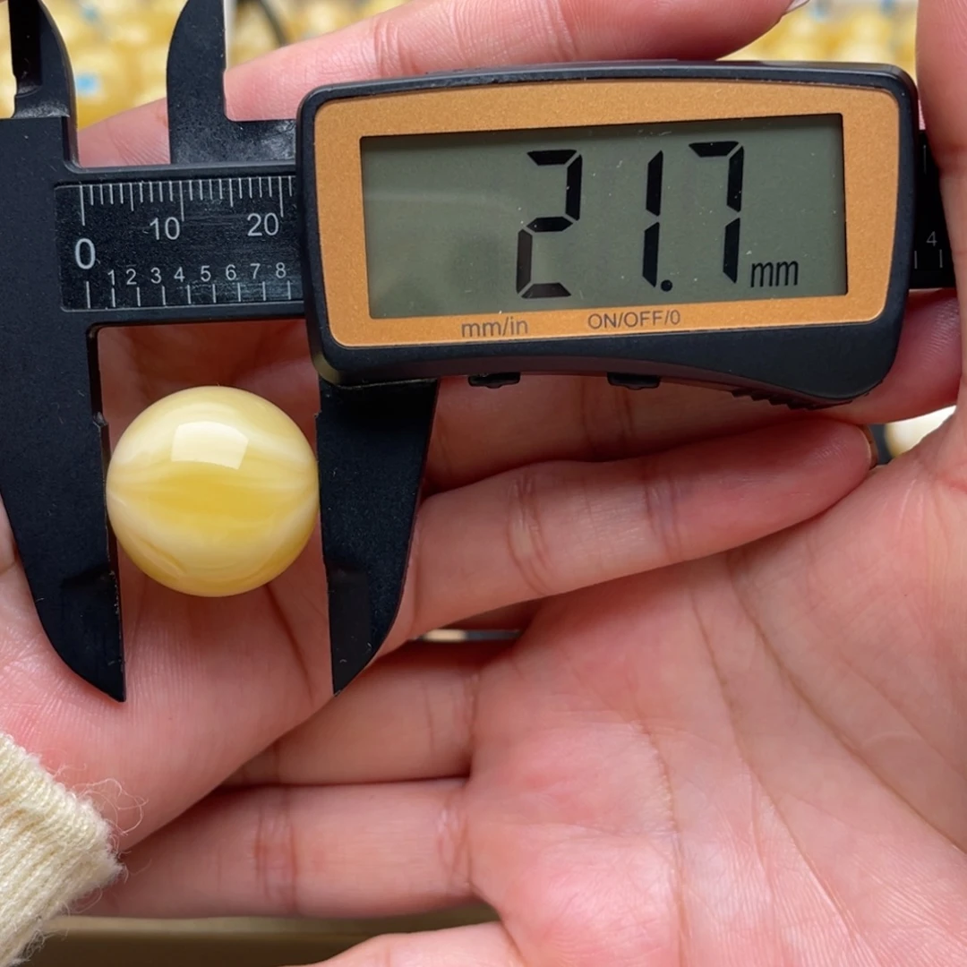 弦***乐琥珀未镶嵌裸石蜜蜡圆珠笑