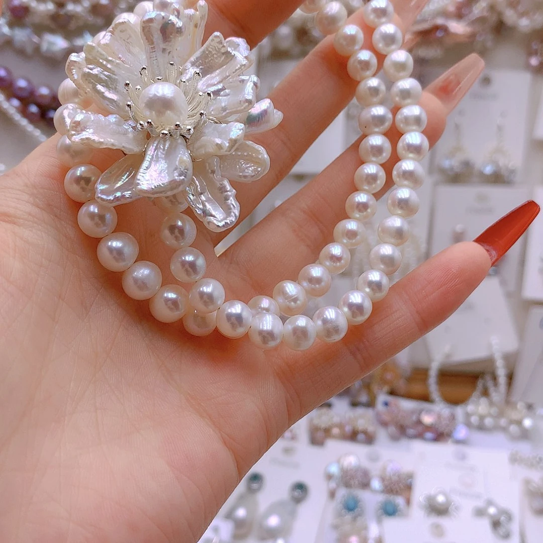 银S925镶嵌耳饰淡水珍珠嗨****?