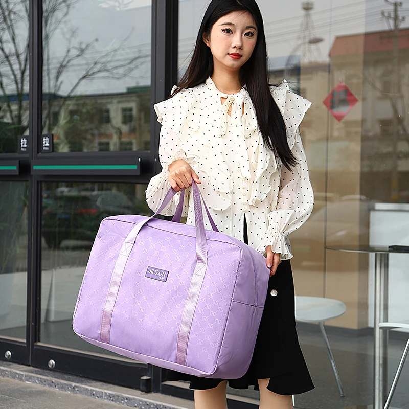 大容量旅行收纳包开学行李包多功能母婴包家用防尘防潮行李袋