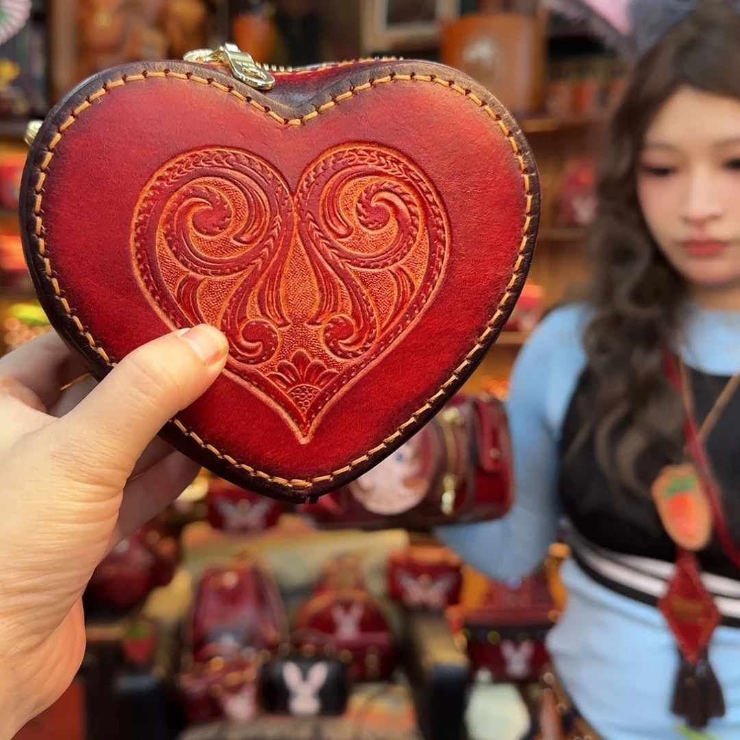 憨***猫牦牛剖层皮革爱心包红色