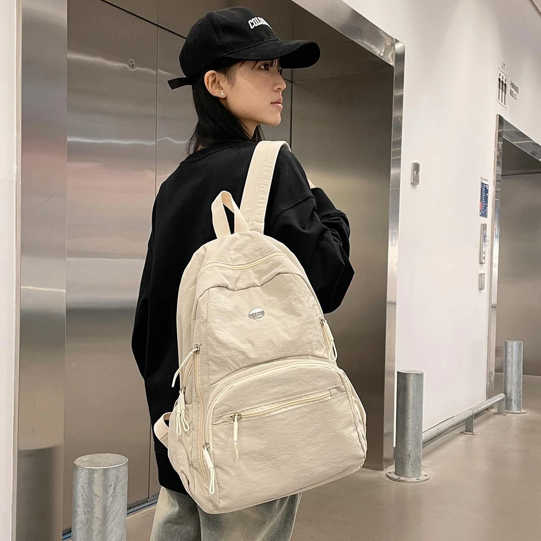 纯色书包大容量初中生女2025新款大背包高中大学生休闲简约双肩包