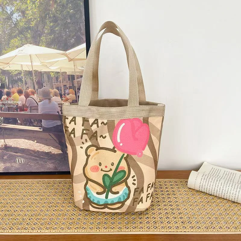 【工厂直销】水桶包可爱涂鸦手提圆桶妈咪收纳包便当袋上班小拎包