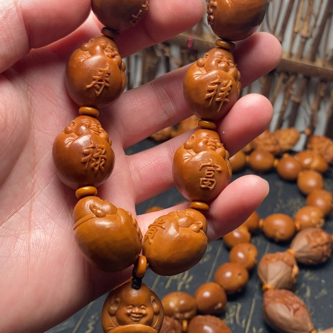 橄榄核手串有**猪弥勒