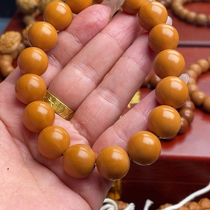 橄榄核吊坠猴头手串