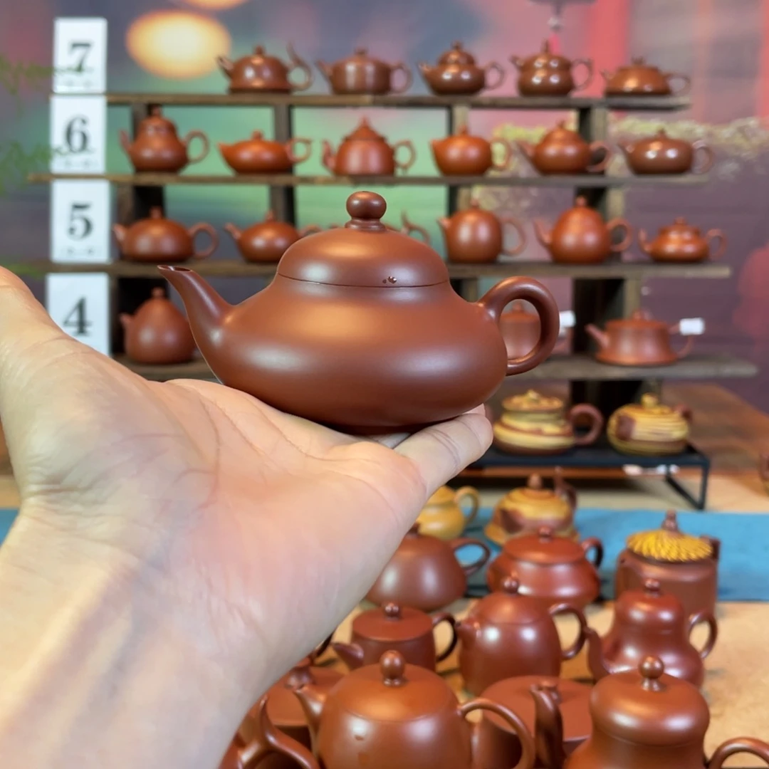 茶壶紫砂雾***_潮州手工手拉朱泥扁梨壶