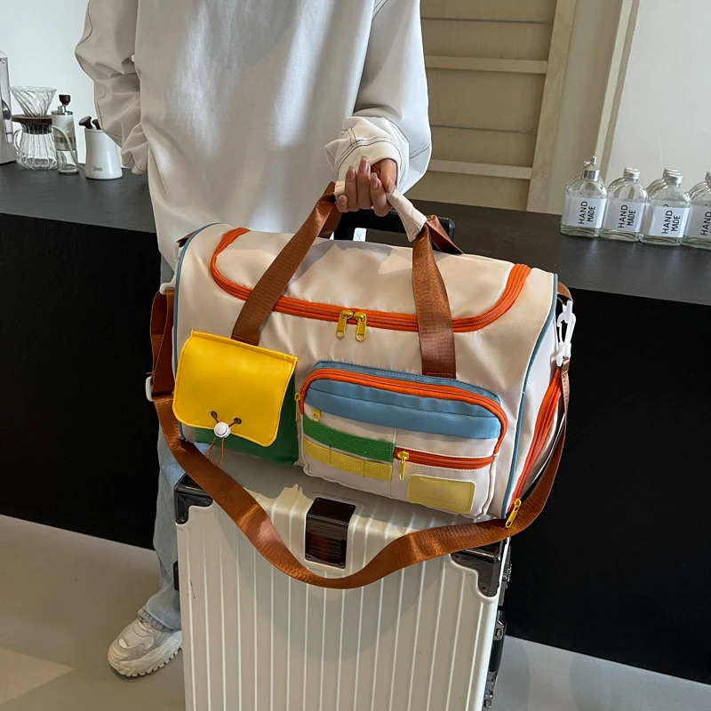 多巴胺撞色时尚新款手提旅行包创意个性休闲斜挎健身包户外短途化