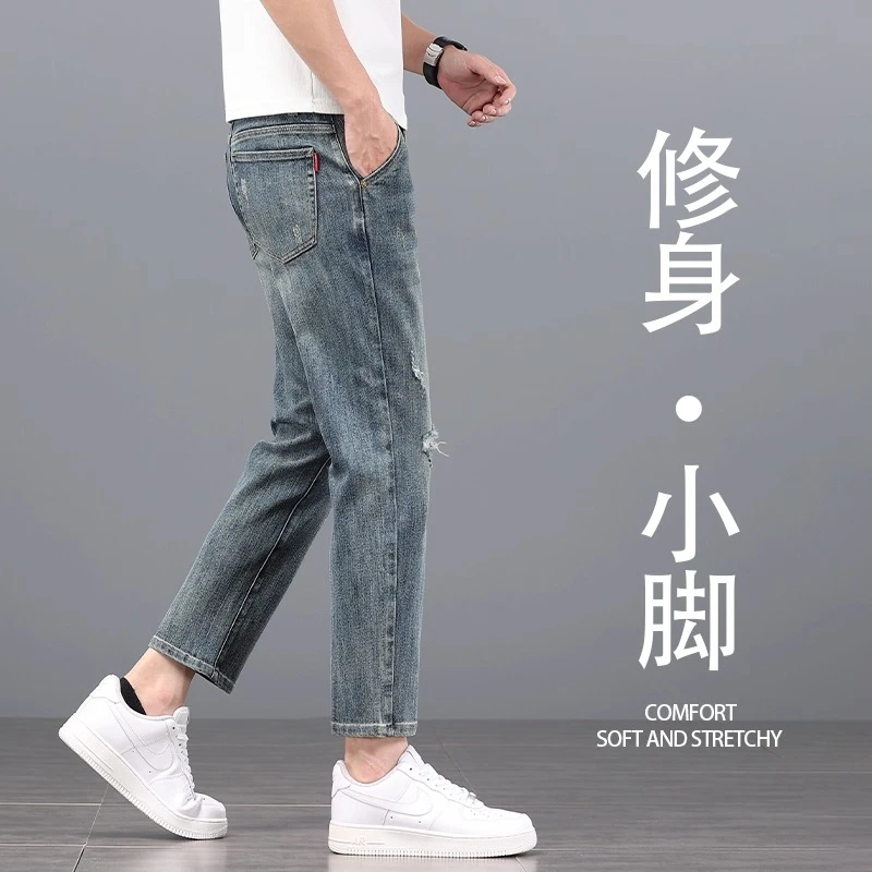 香港高端潮流破洞牛仔裤男士韩版修身小直筒弹力外穿商务九分裤子