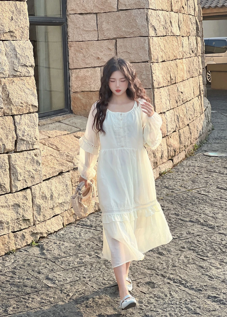 温柔慵懒风荷叶边长袖连衣裙女春季2025新款镂空甜美纽扣初恋长裙