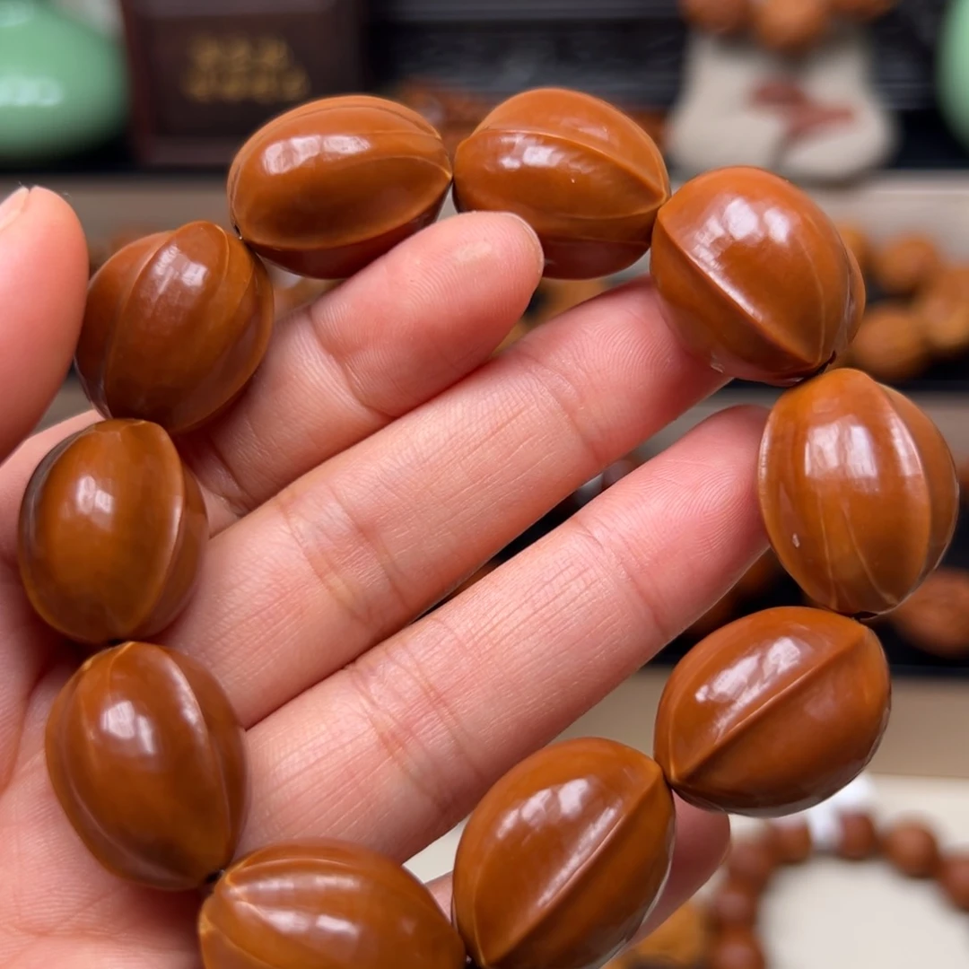 橄榄核吊坠用**?素核手串