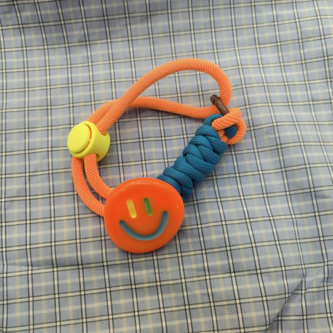 F510橘色笑脸发绳包挂多用