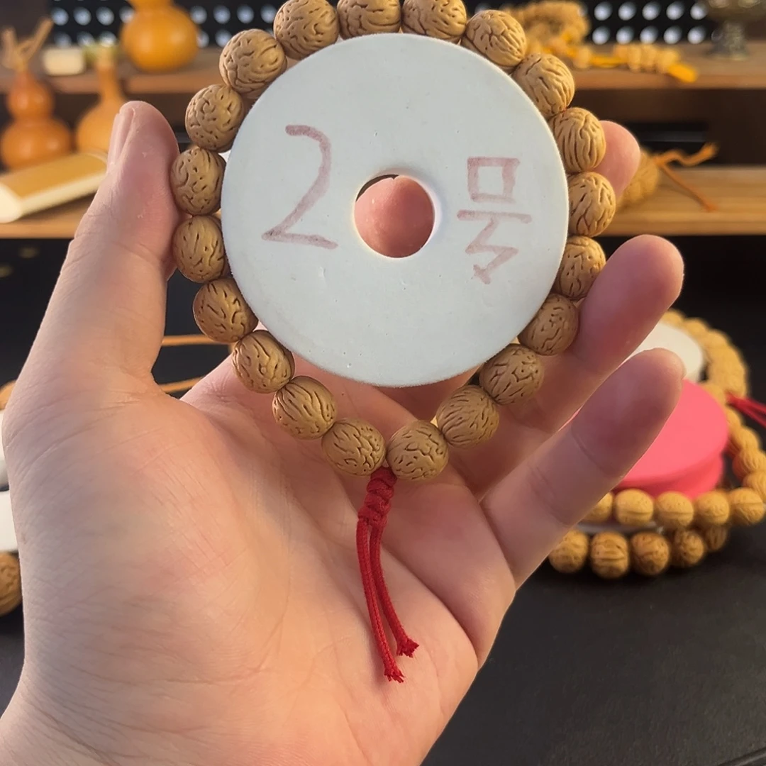 桃核吊坠11mm金丝蛹小钱袋