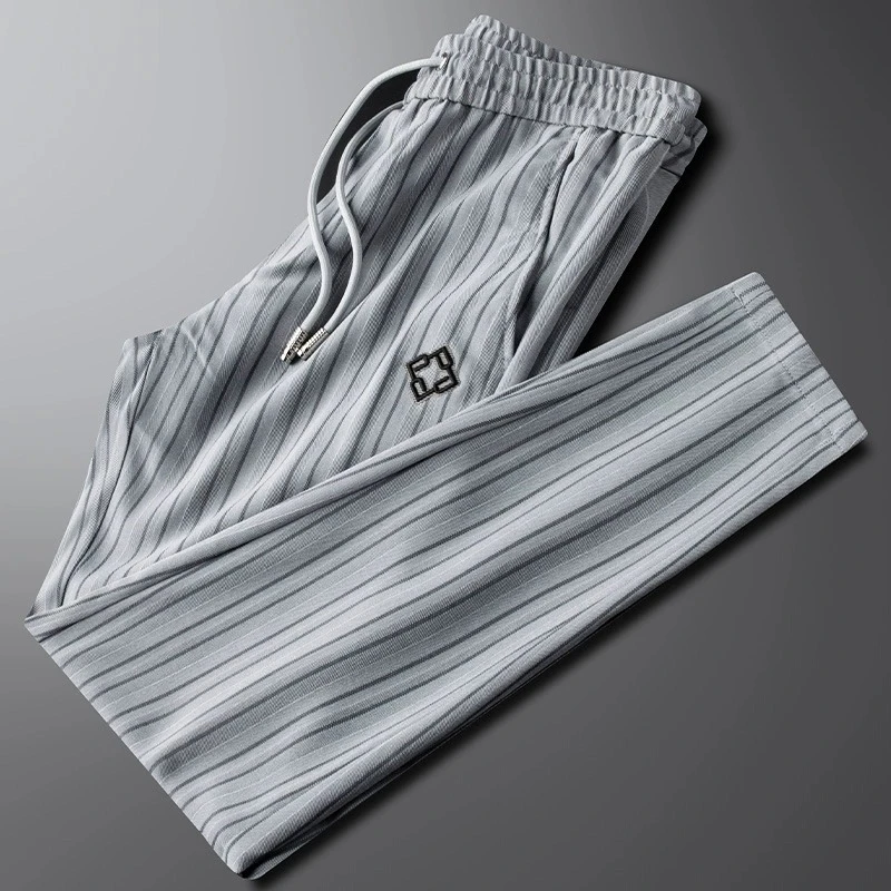 休闲运动裤男士2025新款夏季薄款时尚冰丝条纹修身小脚速干卫裤子