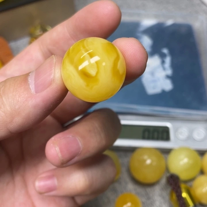 喜***桃琥珀未镶嵌珠宝奇石