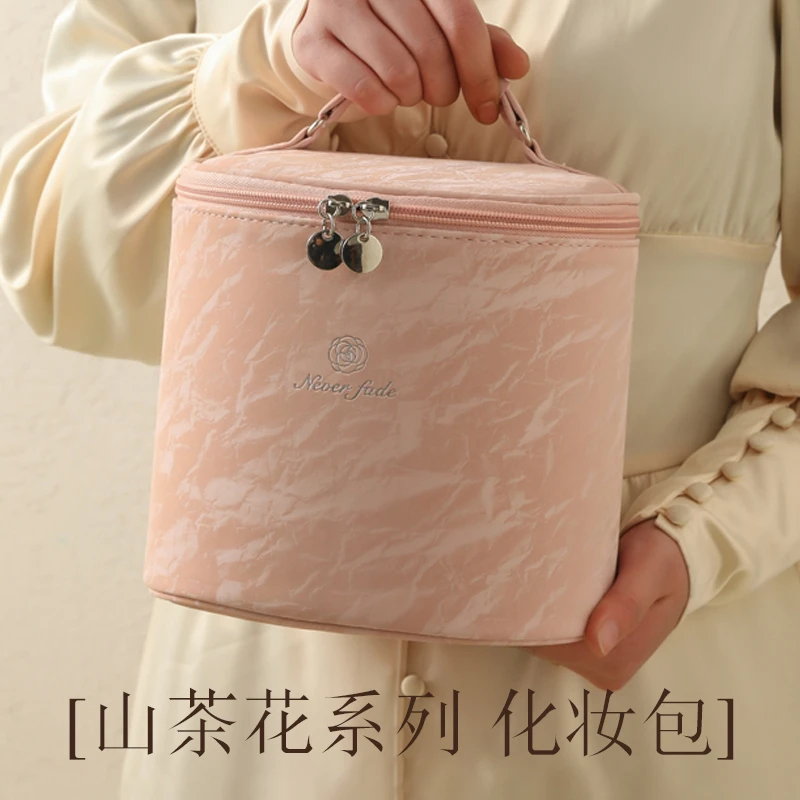 化妆包女2025新款大容量便携式手提护肤品收纳包高级感防水洗漱包