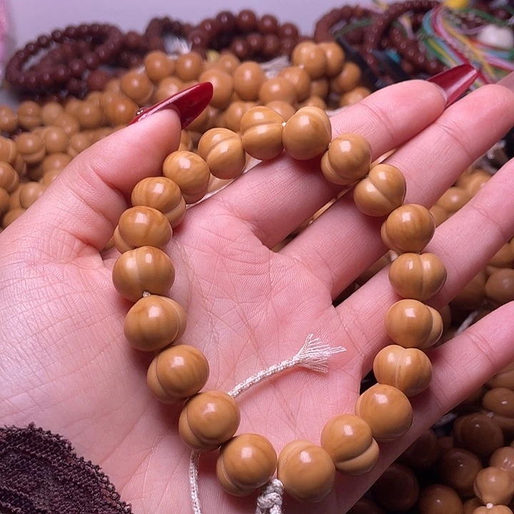 暖****手串猴头核桃15尺寸镜面柯基屁桃手持全品无暇