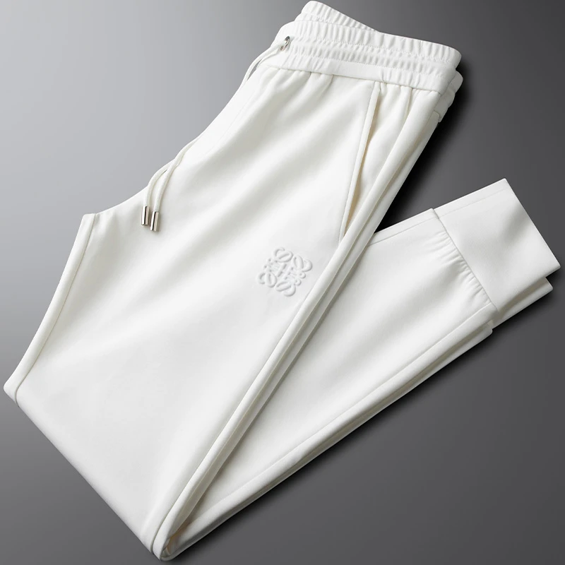 高端潮牌欧货秋冬新款休闲运动裤男修身小脚弹力丝滑白色束脚卫裤