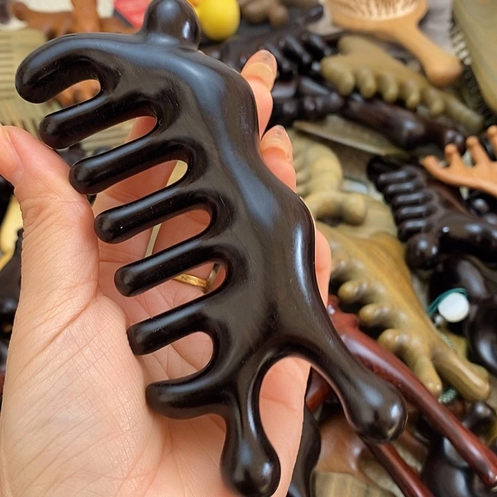 泡***弟紫光檀大蜗牛按摩梳