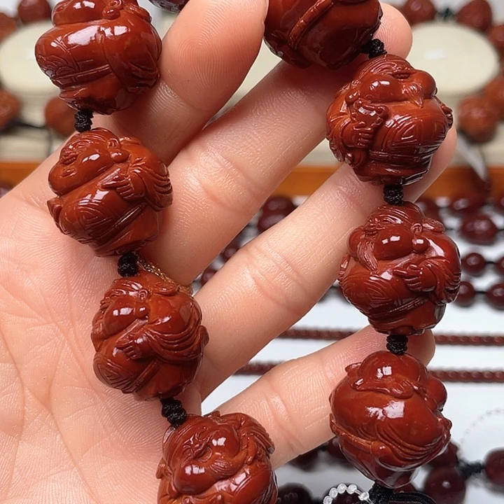 橄榄核手串黄***”包浆玉化