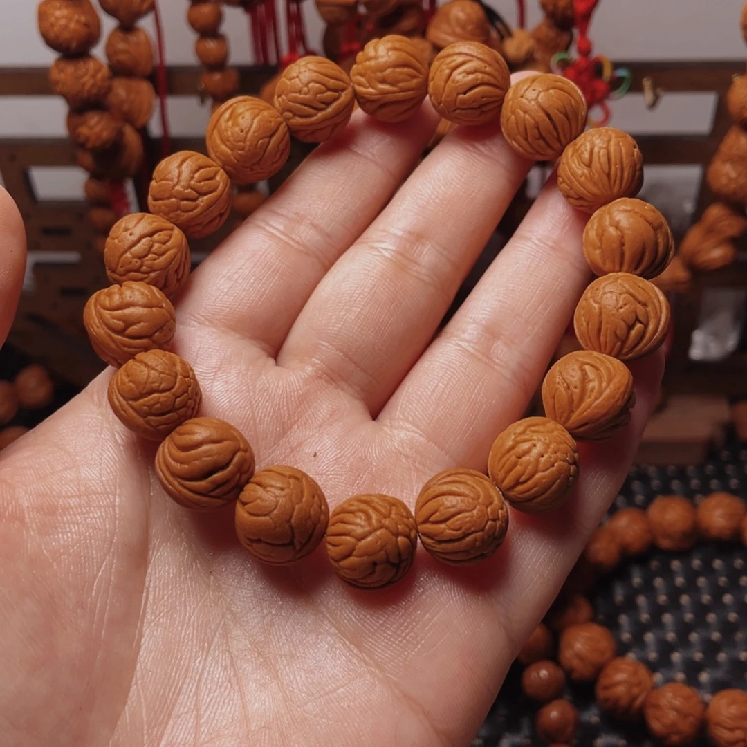 南***摊木质类龙纹桃枭手串